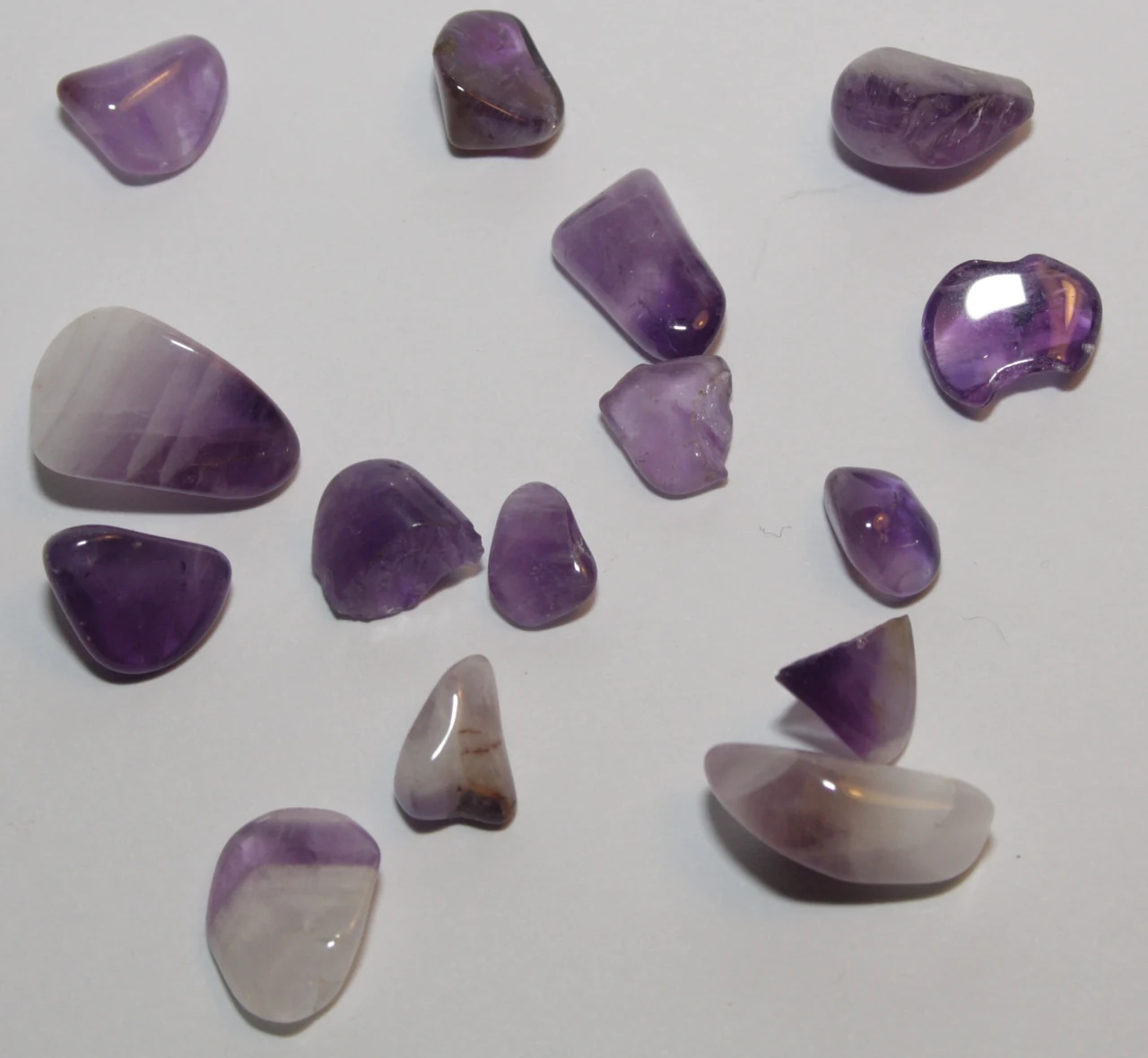 Several polished amethysts with varying purple tones and rounded edges.