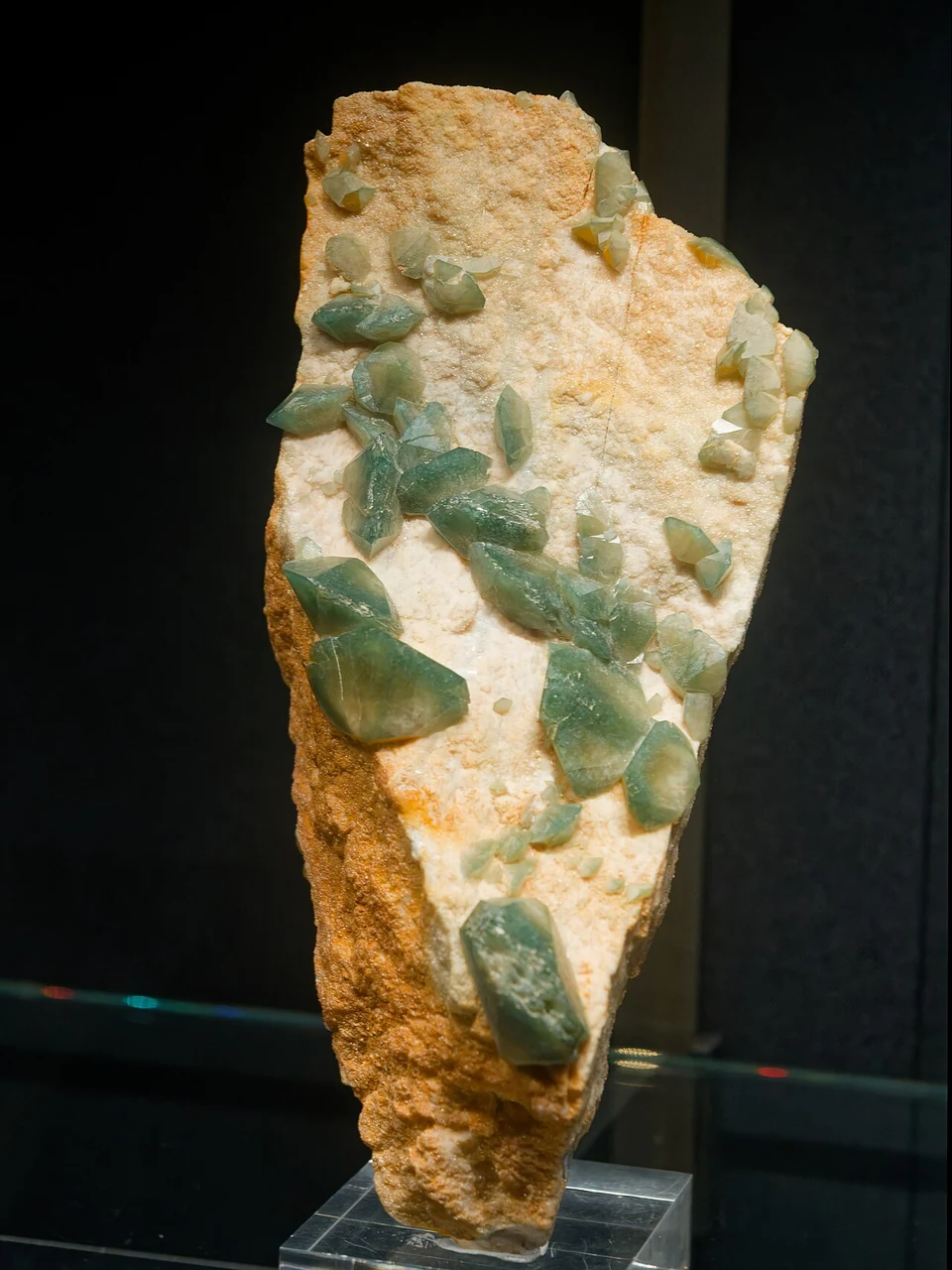 Green apatite crystals on pale matrix