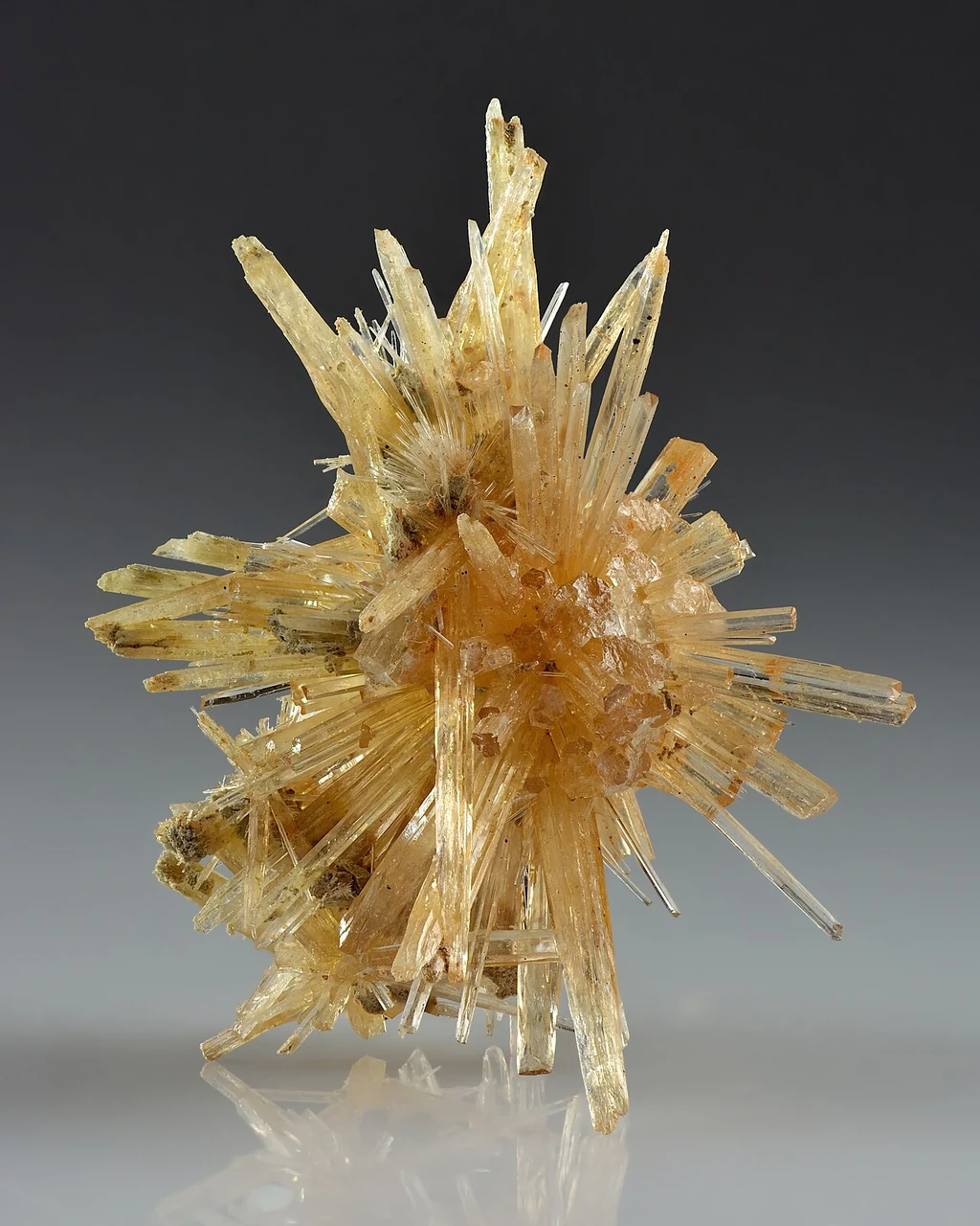 Radiating cluster of yellowish aragonite crystals