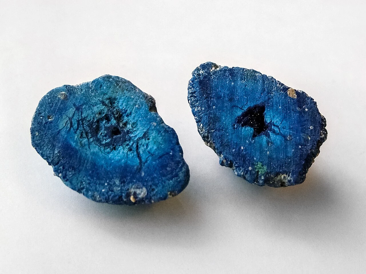 Two halves of an azurite geode with crystals inside