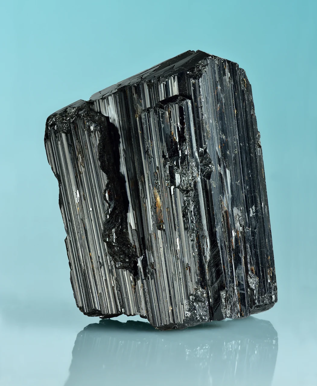 Black terminated schorl crystal from Galiléia, Minas Gerais, Brazil (6.5 × 5.0 × 4.5 cm) with pronounced lengthwise striations.