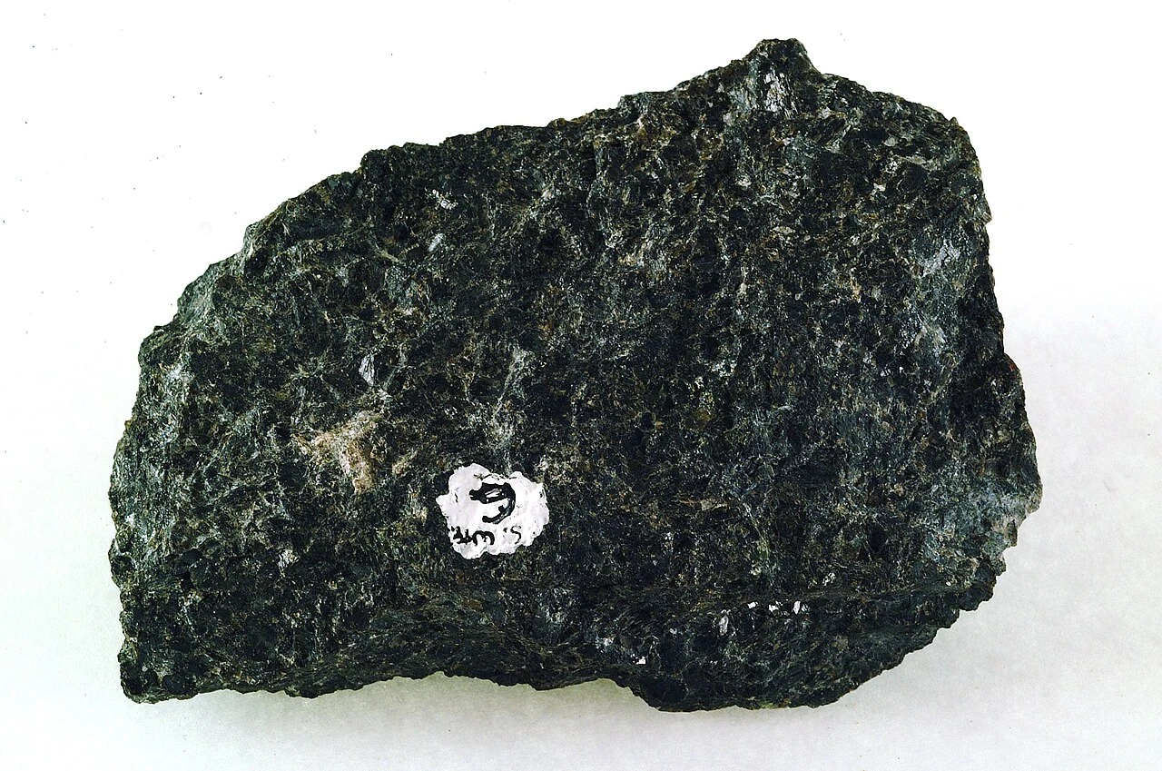 Dark rough specimen containing bronzite