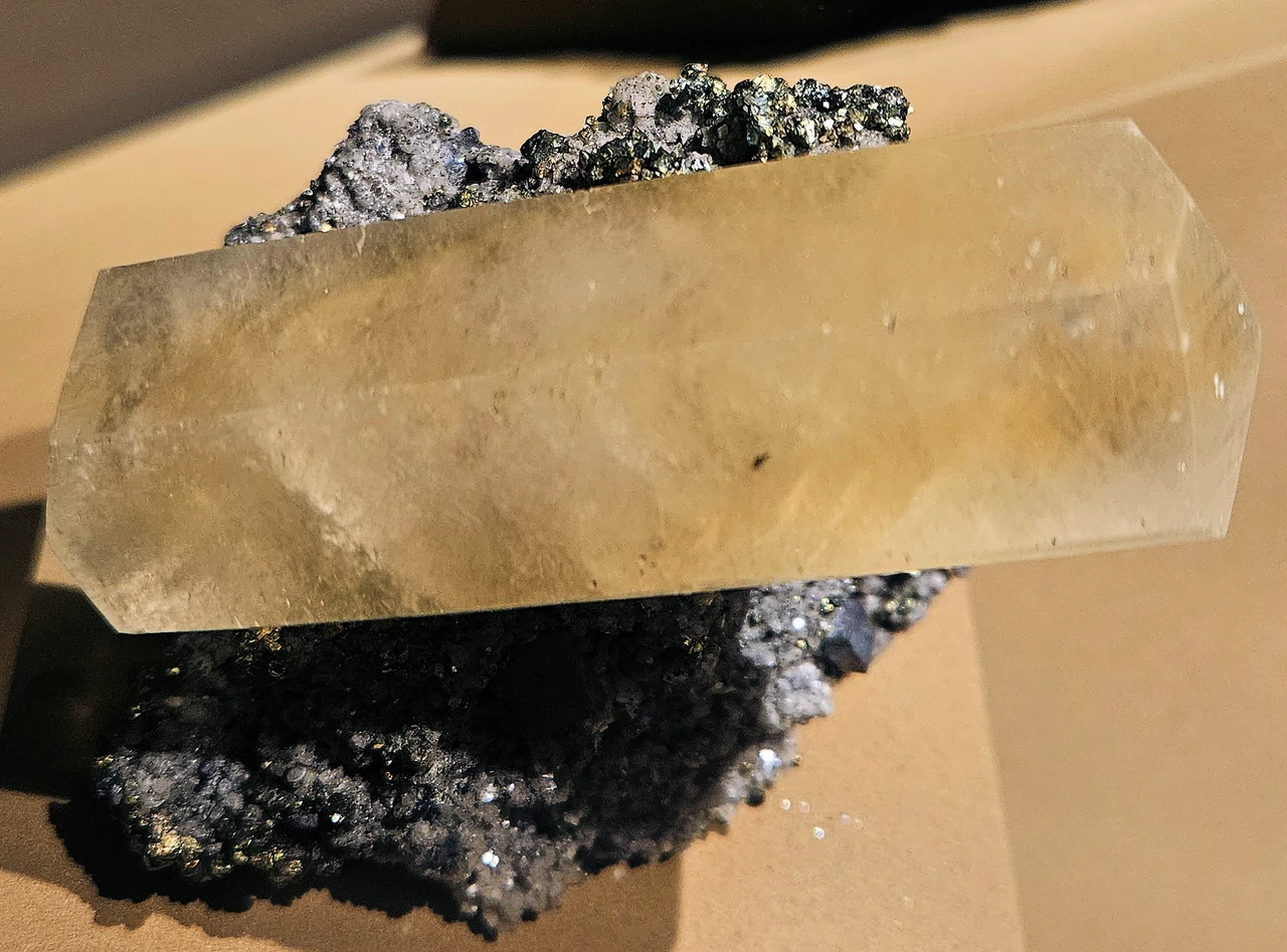 Large yellowish calcite crystal on dark matrix