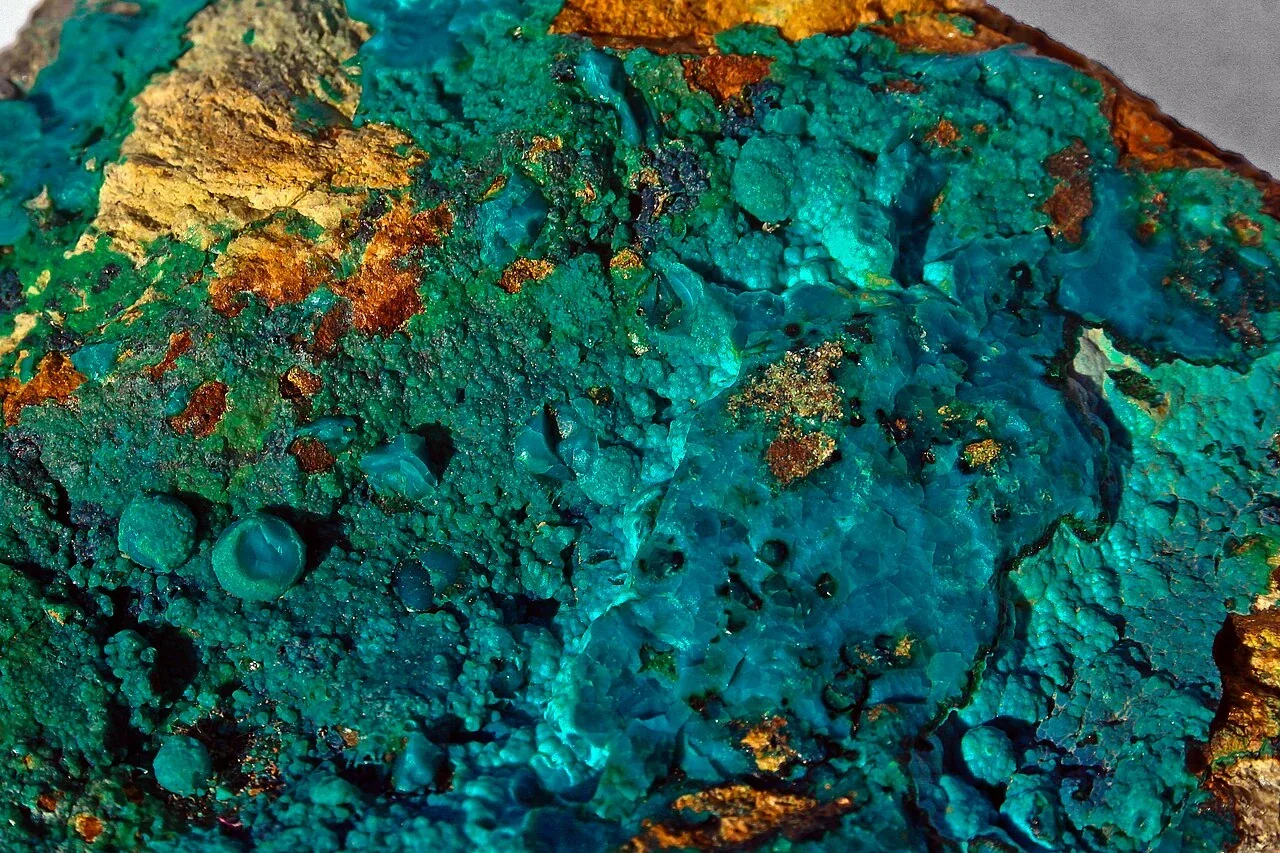 Blue-green chrysocolla on brown rock