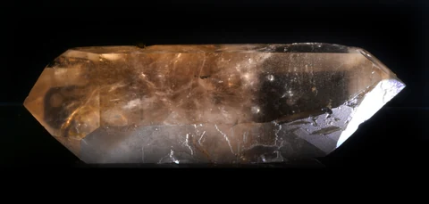 Elongated, double-terminated citrine quartz crystal from Minas Gerais, Brazil (about 18 × 6 cm), transparent and pale yellow-brown.