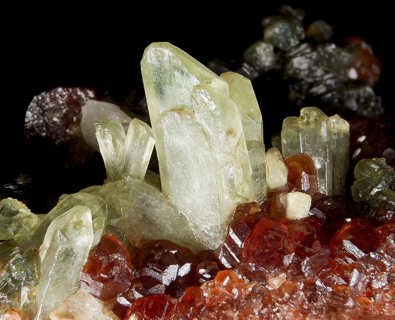 Pale green diopside crystals with hessonite