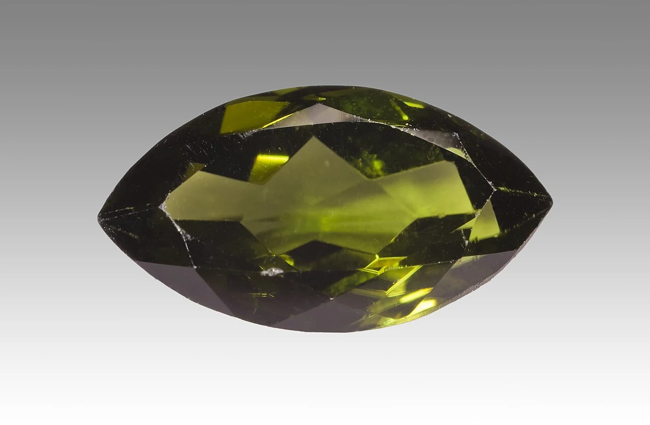 Faceted green diopside with a marquise cut