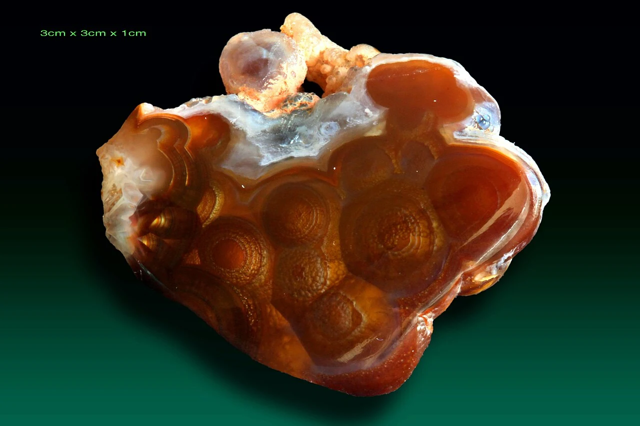 Fire agate from Calvillo with an exposed brown surface