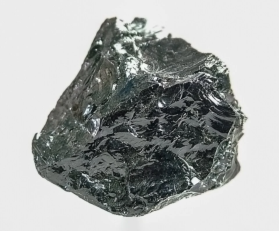 Very dark green, almost black rough tourmaline