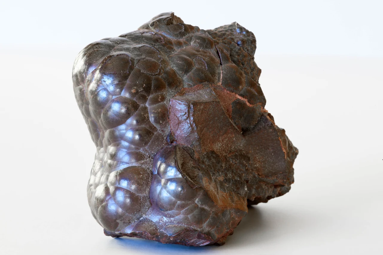 Kidney-ore hematite from the Beckermet Mine, Cumbria, England, with a rounded, reniform metallic surface.