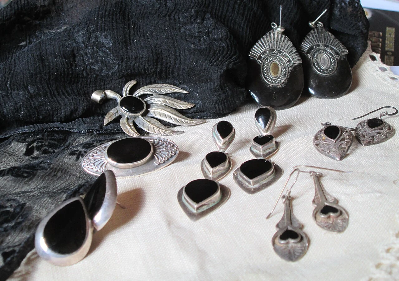 Black jet jewellery in metal settings