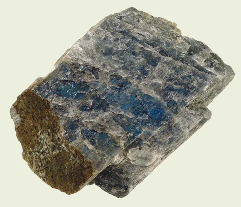 Angular labradorite specimen with a grey body and blue flashes.