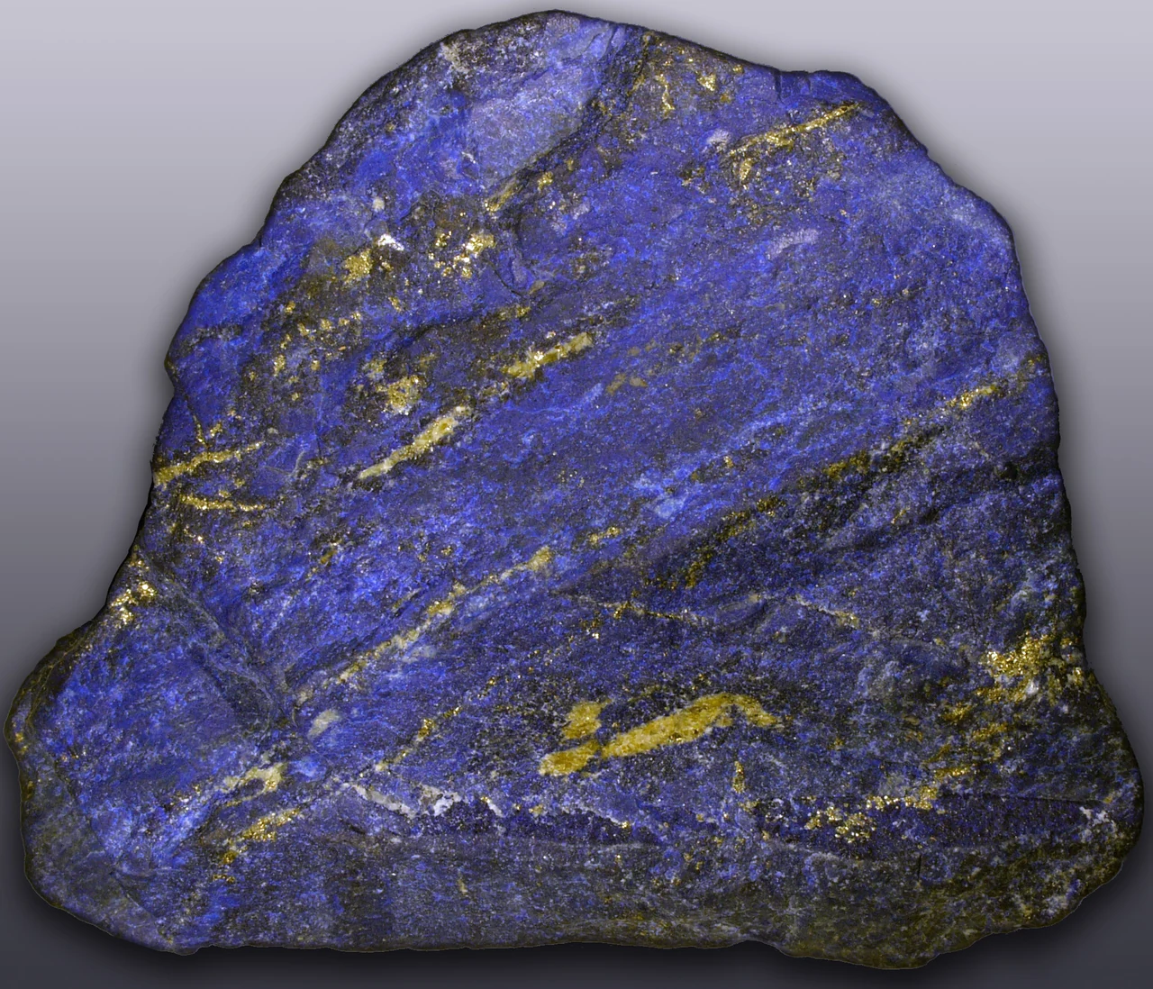 Blue lapis lazuli specimen from Afghanistan with visible gold-coloured pyrite areas.