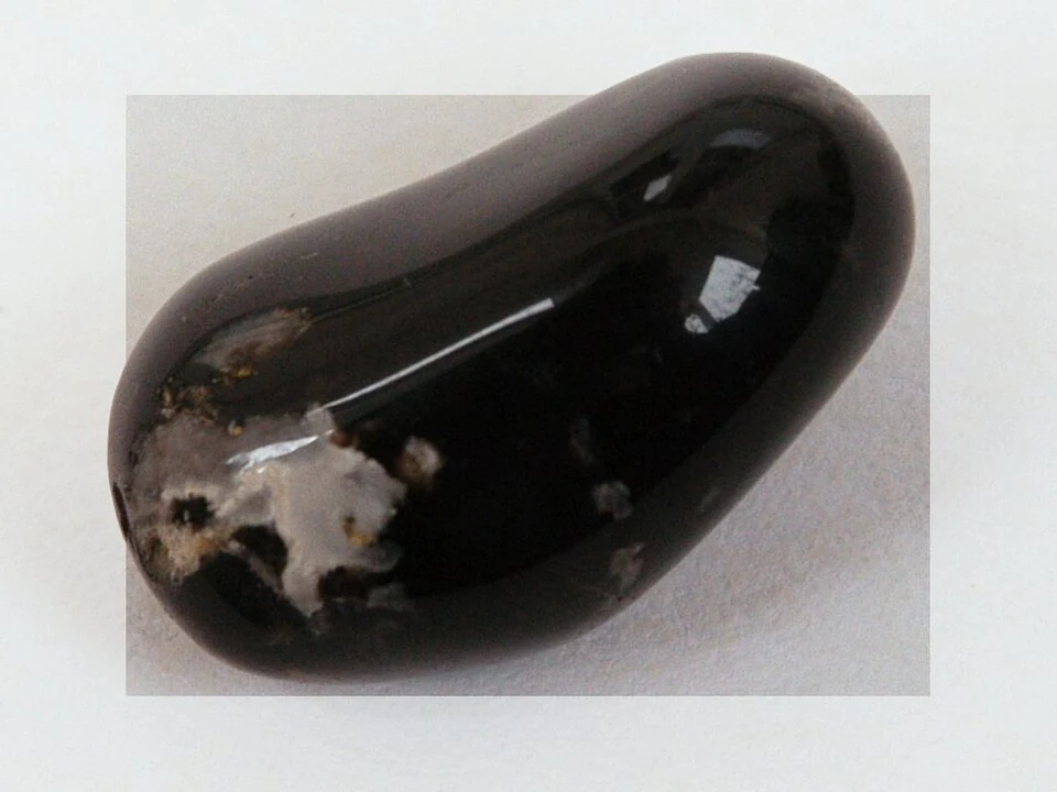 Black polished stone described as onyx
