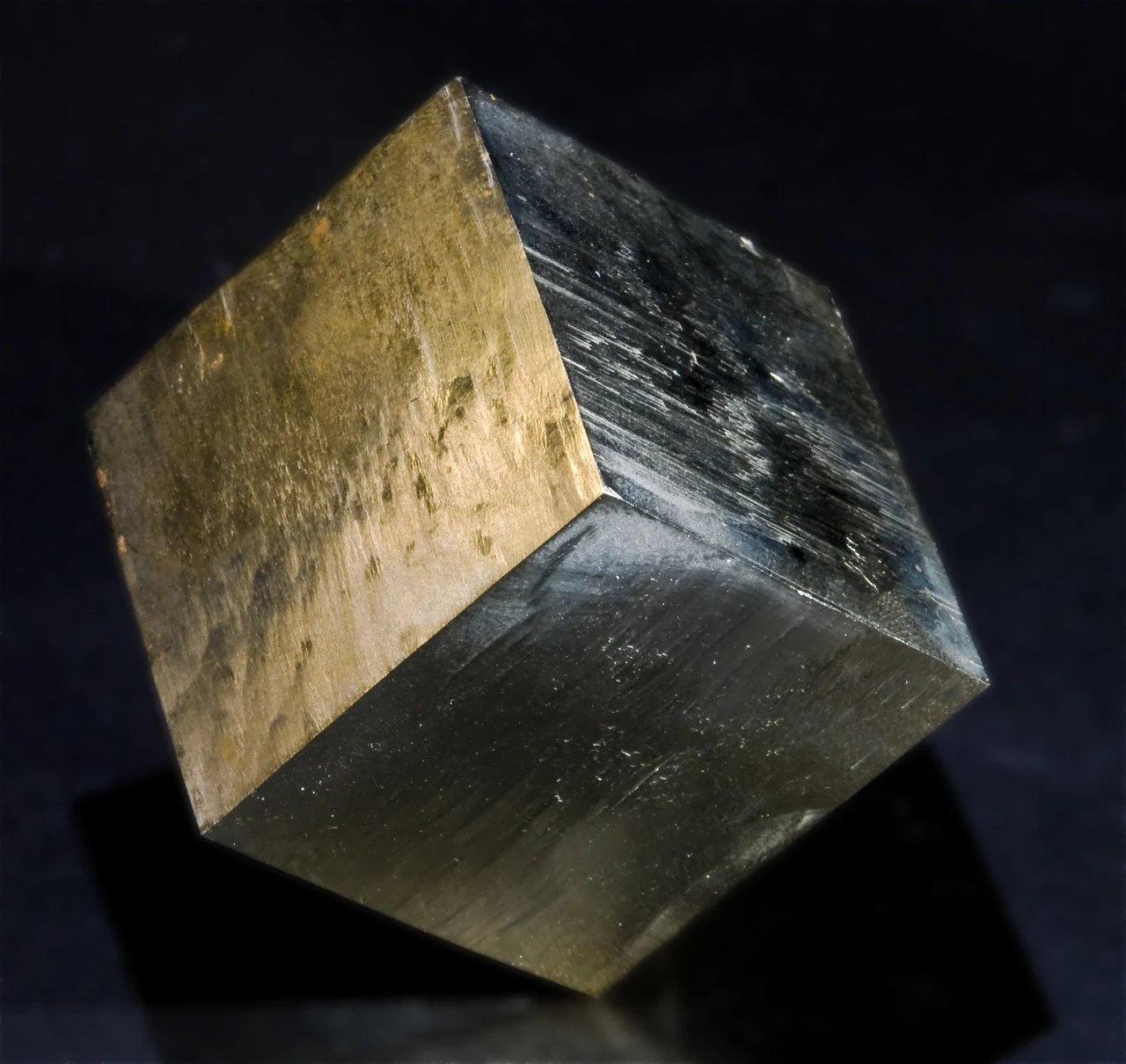 Natural pyrite cube from Navajún, La Rioja, Spain (about 4 cm on edge) with flat faces and metallic lustre.