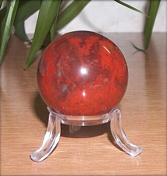 Polished red jasper sphere