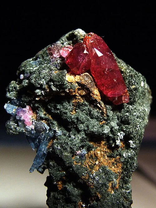 Red ruby crystal on a dark matrix from Winza