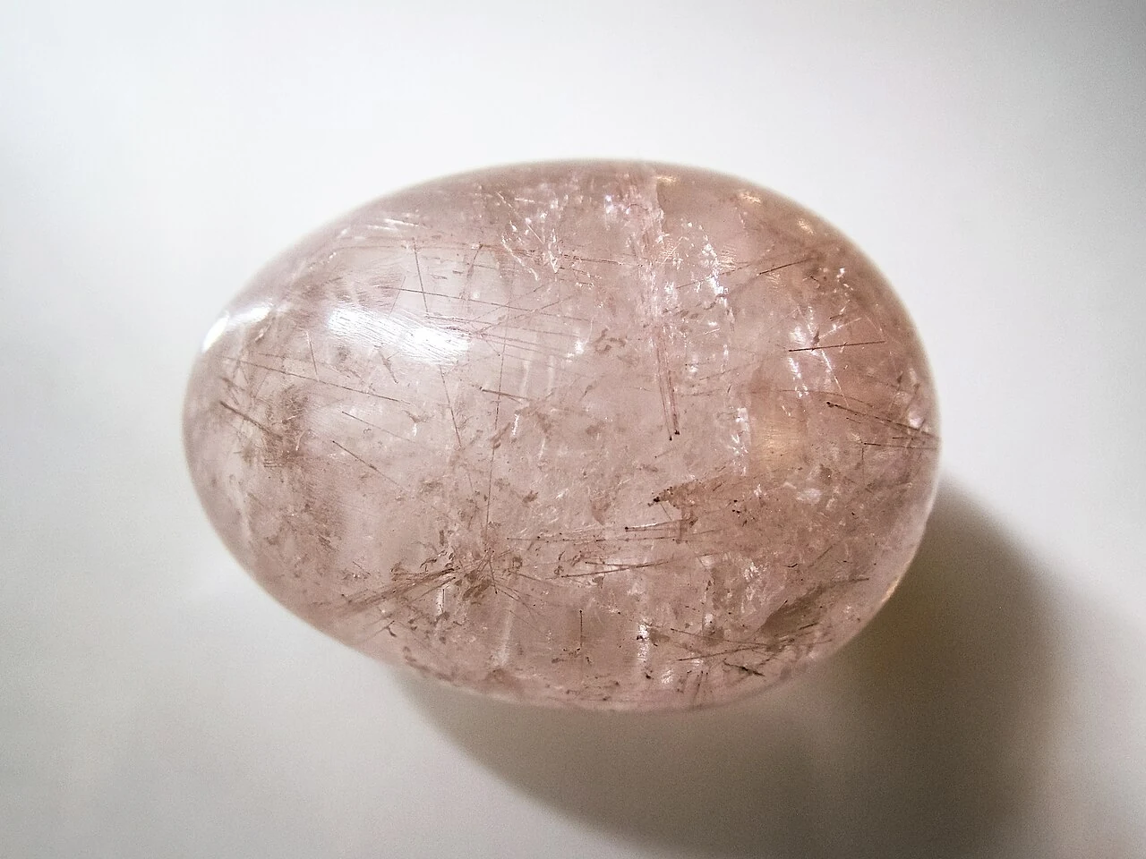 Polished quartz egg with fine rutile needles