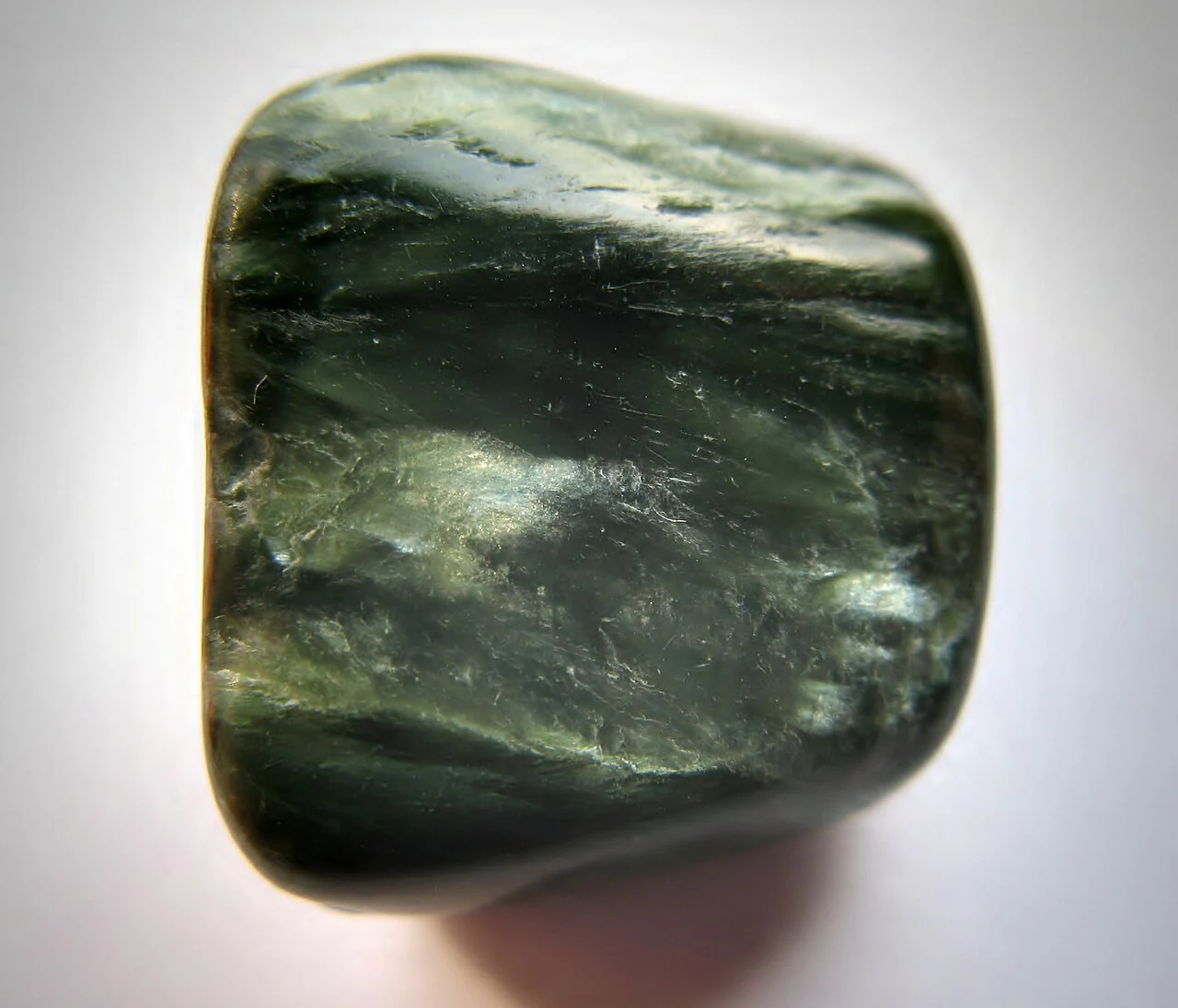 Dark green seraphinite with pale fibrous streaks