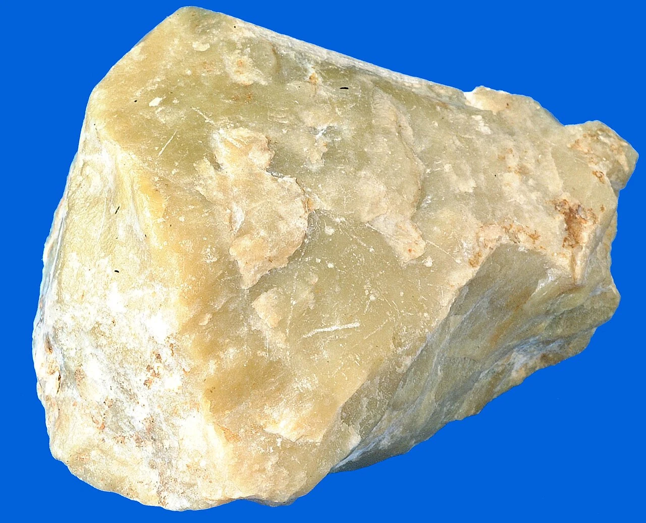 Pale yellow-green specimen of a serpentine-group mineral