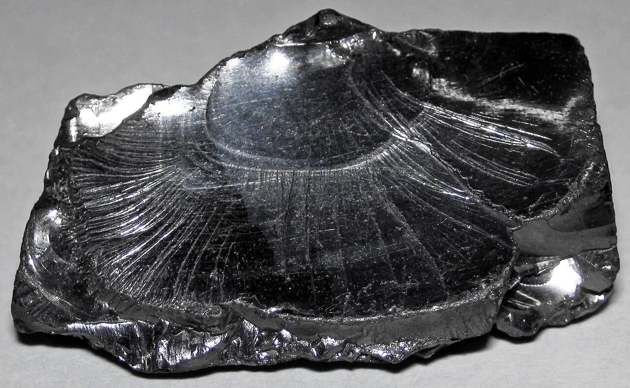 Lustrous black shungite with conchoidal fracture