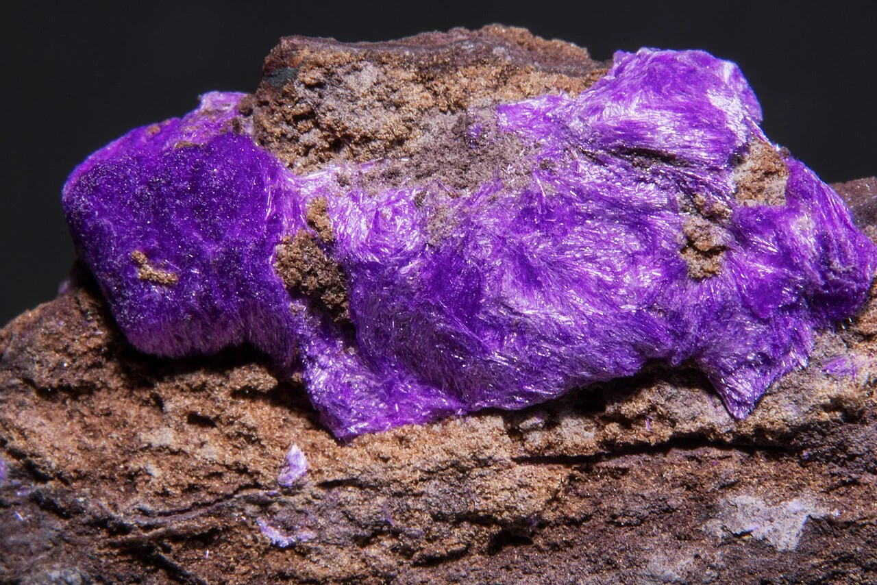 Purple sugilite in brown matrix