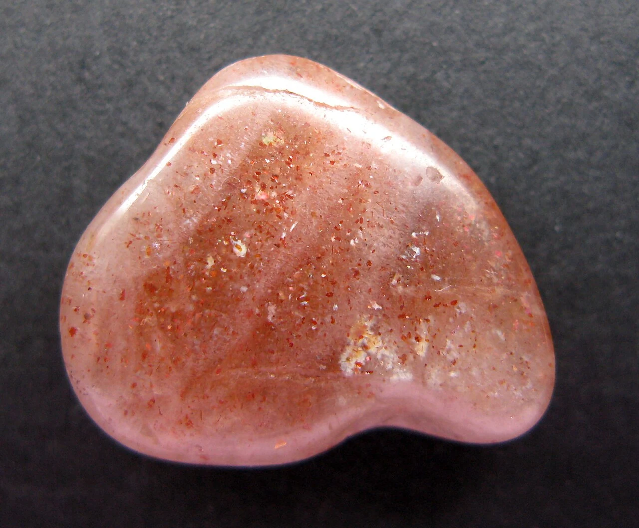 Polished sunstone with small sparkling inclusions